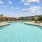 Community Pool with Picnic Area and Poolside Loungers
